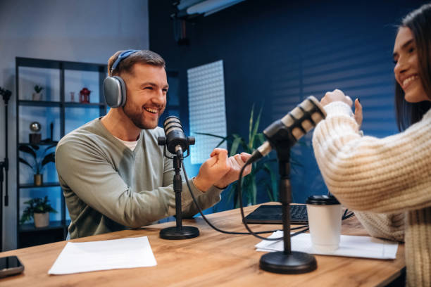 istock In the studio, talking. Radio hosts recording podcast 2189019296