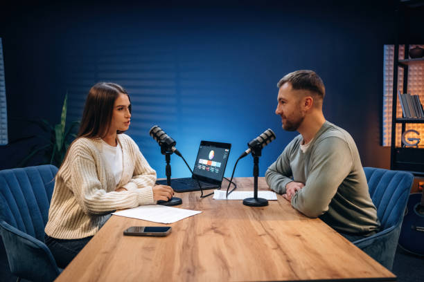 istock Having a conversation. Radio hosts recording podcast 2189019382