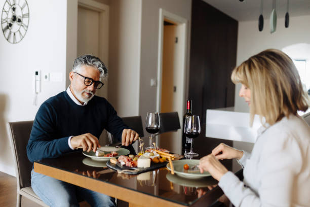 istock Senior couple dating at home 2189021006