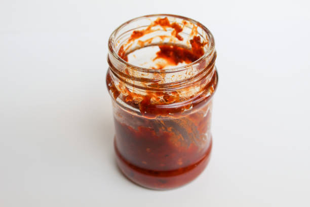 istock Sambal is an Indonesian chilli sauce or paste. In a transparent glass jar. Isolated on white background 2189021557