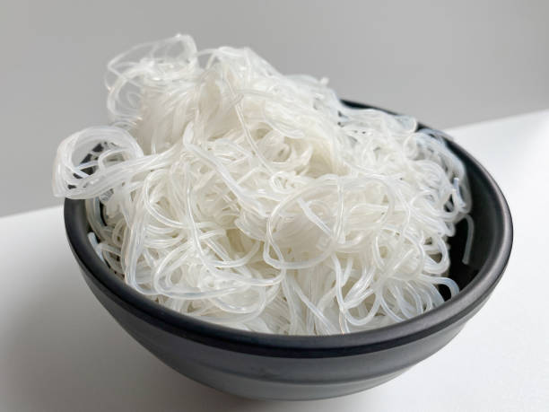istock Rice noodle on black bowl, isolated on white background 2189022356