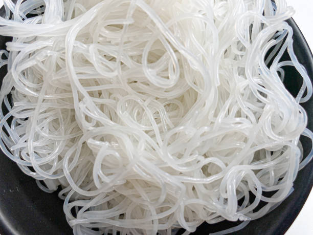 istock Rice noodle on black bowl, isolated on white background 2189022469
