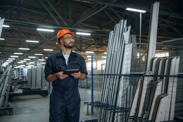 istock With digital tablet. Man is working in the modern factory 2189022513