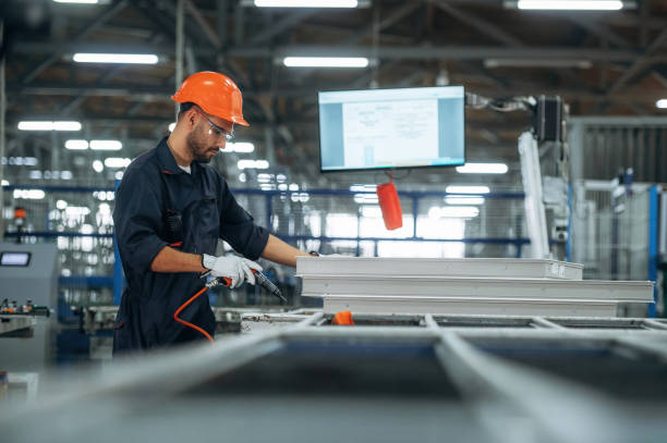 istock Indoors in the factory, standing. Man is working 2189023891