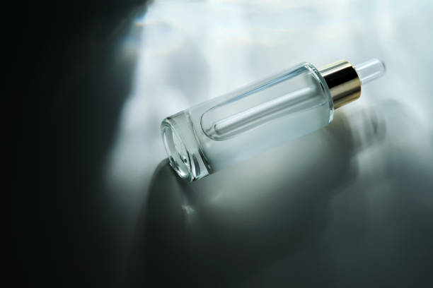 istock Bottle of face serum with a pipette with a beautiful highlight. 2189023972