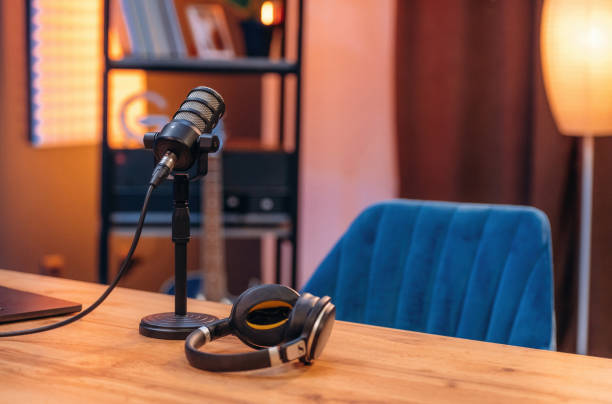 istock Microphone and headphones are on the table, room for podcasts 2189025366