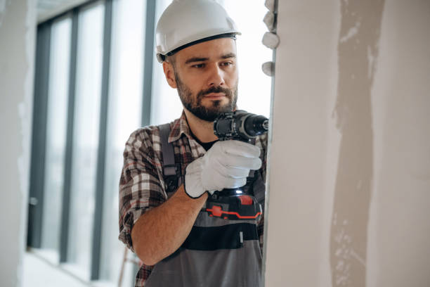 istock Focused on the work. A man is renovating an unfinished room 2189025512