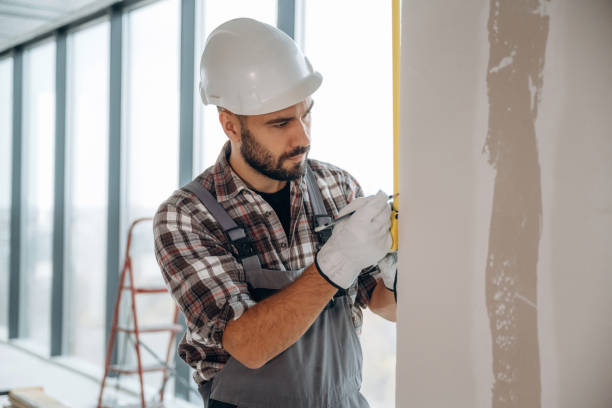 istock Focused on the work. A man is renovating an unfinished room 2189025531
