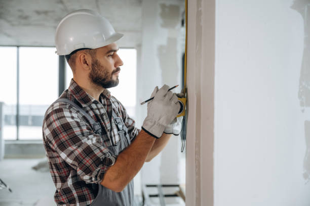 istock Focused on the work. A man is renovating an unfinished room 2189025561