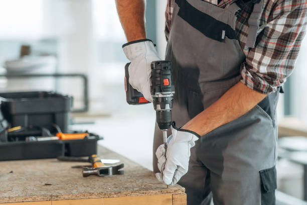 istock Focused, tools. Close up view of worker that is renovating unfinished room 2189026746