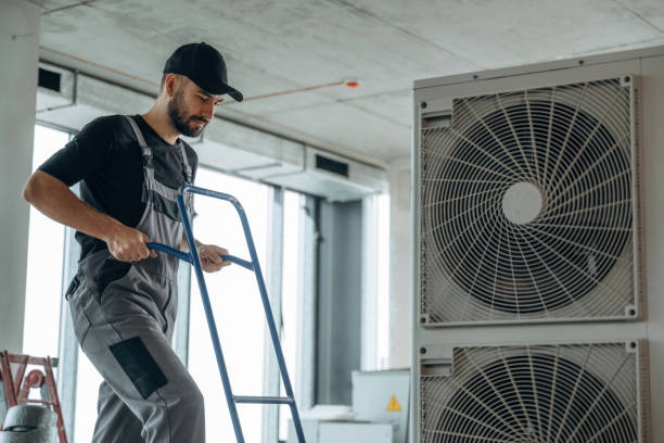 istock Big air conditioner. A man is renovating an unfinished room 2189026866