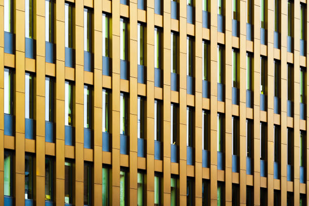 istock Abstract Golden Facade with Vertical Panels and Geometric Repetitions in Modern Architecture 2189027723