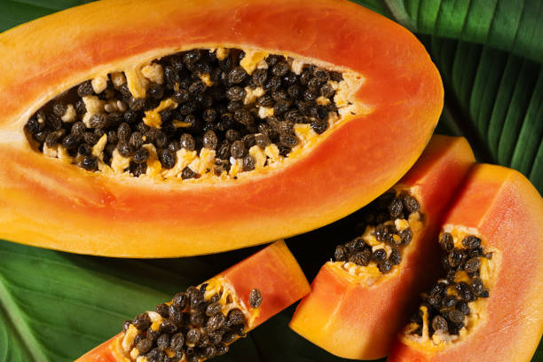 istock Juicy papaya fruit slices top view. Tropical papaya fruit background. 2189027982