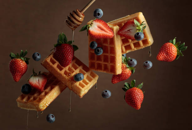 istock Waffles with blueberries, strawberries, and honey. 2189030758