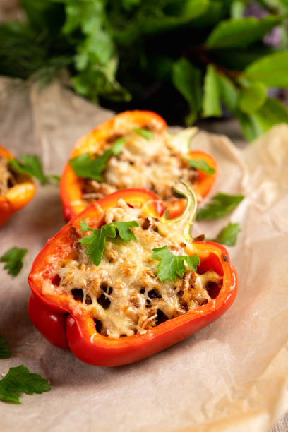 istock Stuffed peppers with herbs and cheese on the rustic background 2189031823