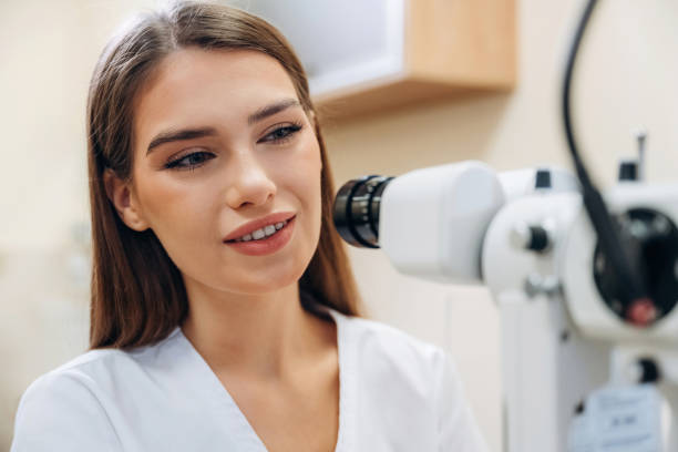 istock Digital optical device. Young female ophthalmologist is in the cabinet 2189031852