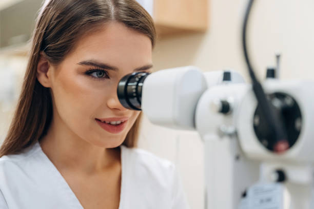 istock Digital optical device. Young female ophthalmologist is in the cabinet 2189031855