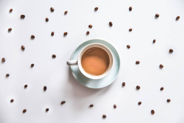 Cups filled with coffee beam's isolated on a white background