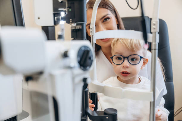 istock In the ophthalmologist cabinet. Little boy is having check up 2189034641