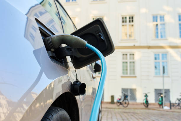 istock Electric car charging at public charging station 2189035435