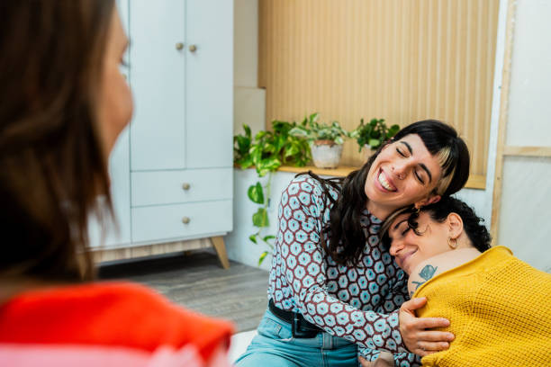 istock Friends embracing at home 2189036007