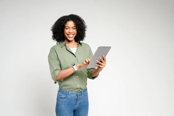 istock African-American woman holding a tablet 2189036385