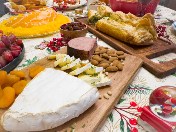 Image of varied food with cheeses, sweets and fruits