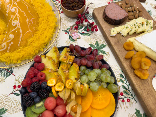 Image of varied food with cheeses, sweets and fruits