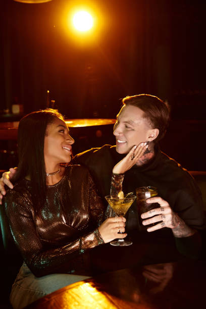 istock Multicultural couple shares a romantic evening at a cozy bar 2189038329