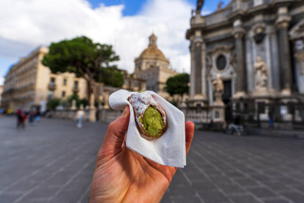 istock Sicilian cannolo in hand, personal perspective 2189042411