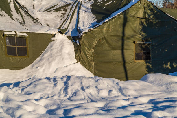 istock Army Tent Covered in Winter Snow on a Sunny Day 2189042493