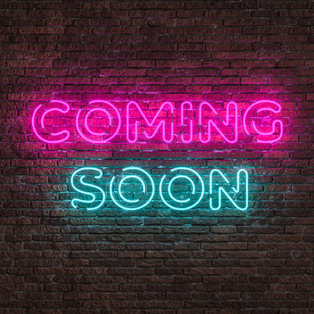 istock Coming soon neon sign hanging on brick wall 2189043546