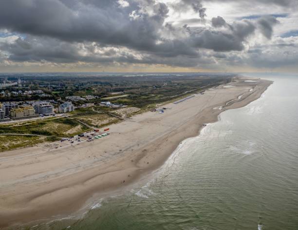 istock Aerial view of sandy beach and coastal town. 2189043779