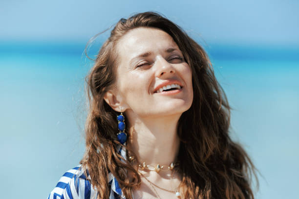 istock smiling modern female on seashore enjoying tranquility 2189044246
