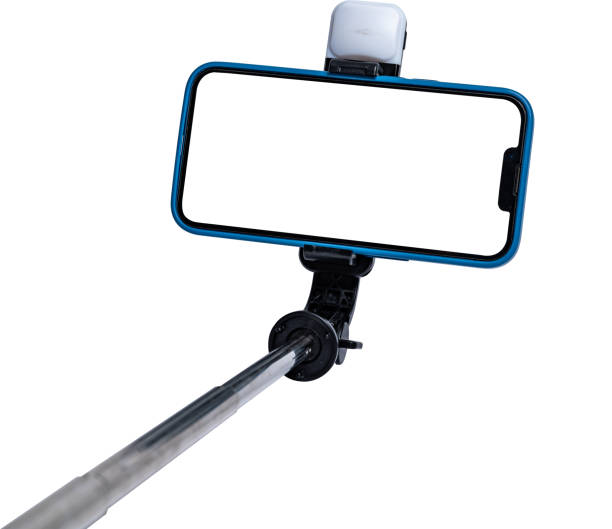 istock Selfie stick and smartphone on white background with white cut out screen. 2189046554