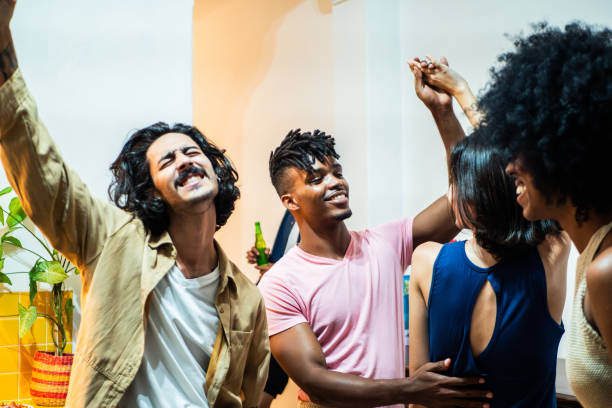 istock Young friends talking at home 2189049089