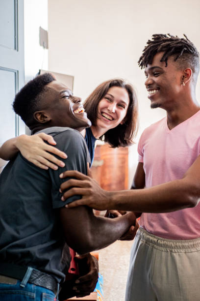 istock Young man greeting friends at home 2189049184