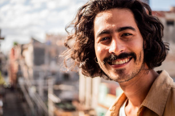 istock Portrait of young man at balcony 2189049926