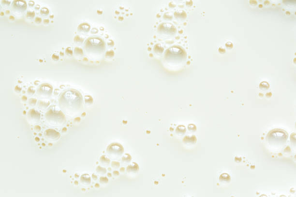 istock Close-up macro milk texture,White milk or soy bubble foam background on top view close up, 2189050310