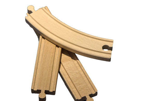 istock model train track puzzle pieces for small trains on rails (wood toy for kids close up isolated on plain background) white yellow piece cut out children's holiday gift 2189051769
