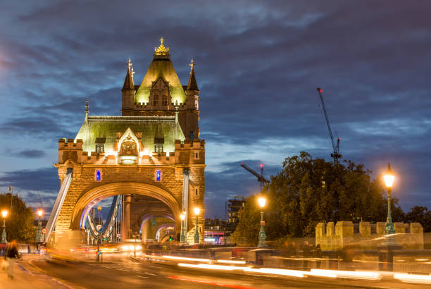 The famous Tower Bridge over the River Thames at night, illuminated, in London, England, United Kingdom