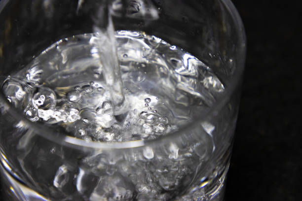 istock Water being poured into glass 2189053084