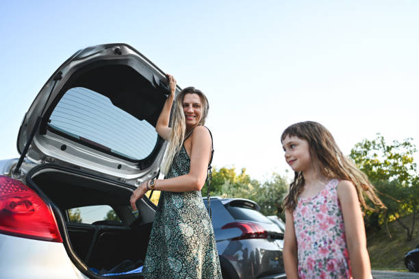 istock unpacking luggage from the car 2189054017