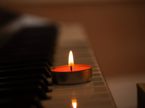 istock Candles with piano organ musical instrument background 2189055057