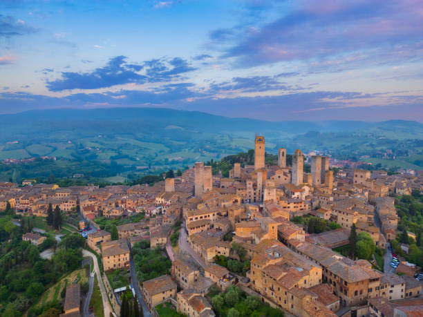 istock San Gimignano at dusk, medieval Tuscan town from drone 2189059791