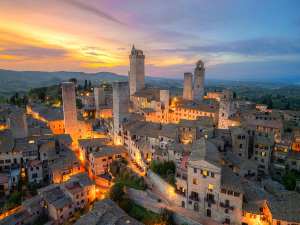 istock San Gimignano at dusk, medieval Tuscan town from drone 2189059792