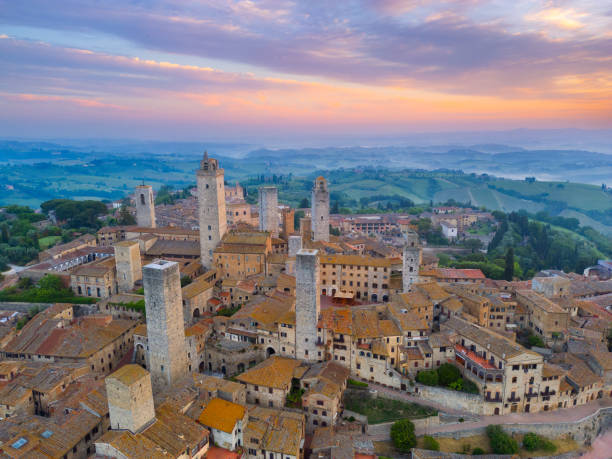 istock San Gimignano at dusk, medieval Tuscan town from drone 2189059797