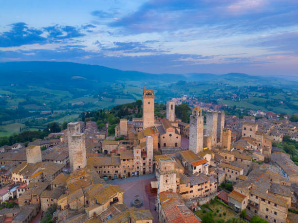 istock San Gimignano at dusk, medieval Tuscan town from drone 2189059815