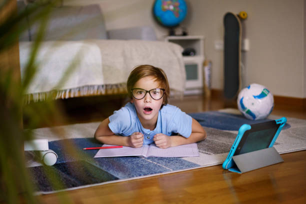 istock Boy whit eyeglasses studying at home 2189060267