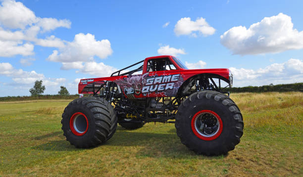 Little Gransden, Cambridgeshire, England -  August 25, 2024: Game Over Monster Truck close up parked on grass